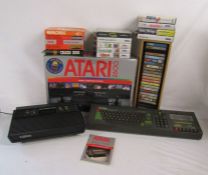 Atari 2600 (missing controllers) with games and Amstrad console also include some Sega Mega Drive