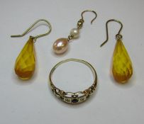 A small collection of gold comprising of a pair of 9ct gold drop earrings and a 9ct single earring