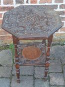 Late 19th/early 20th century octagonal ornately carved table W47cm Ht 69cm