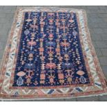 Persian hand woven blue ground rug 190cm by 119cm