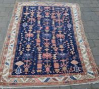 Persian hand woven blue ground rug 190cm by 119cm