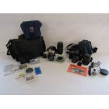 An Olympus SP-700 compact digital camera, Canon EOS 1000F film camera with case and Canon  EOS 300
