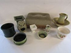 A mixed collection of plant pots (some showing damage repairs) and a footstool