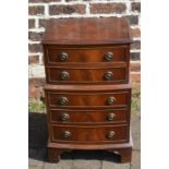 Small reproduction bow fronted chest on chest Ht 73cm W 47cm D 34cm