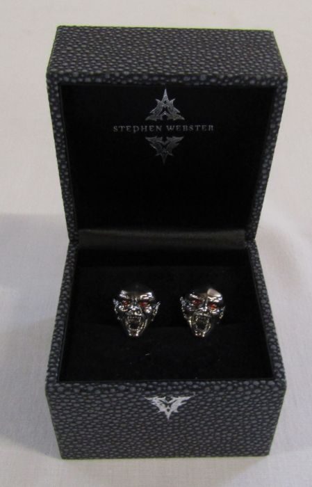 Boxed pair of silver designer Stephen Webster Dracula head cufflinks with red bead eyes, weight 20.5