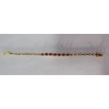 14ct gold ladies bracelet with diamond and ruby stones (diamond missing) - total weight 8.9g