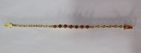 14ct gold ladies bracelet with diamond and ruby stones (diamond missing) - total weight 8.9g