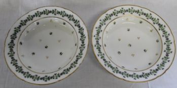 Pair of 18th century porcelain soup bowls bearing Sotheby's Country House Sale sticker, 25cm dia.