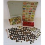 A large collection of matchbox fronts, mixed coins to include one pennies and a Thrift box