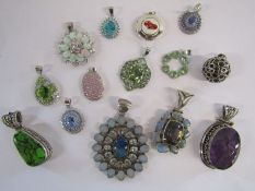 Collection of 14 silver pendants