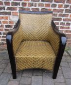 Wicker weaved and hardwood arm chair with cushion