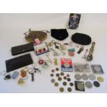 A collection of items to include coins, keyrings, small ladies bags, thimbles etc