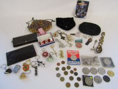 A collection of items to include coins, keyrings, small ladies bags, thimbles etc