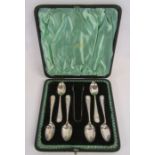 A cased set of six Walker & Hall silver teaspoons and sugar tongs dated 1902 - total weight 3.24
