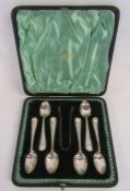 A cased set of six Walker & Hall silver teaspoons and sugar tongs dated 1902 - total weight 3.24