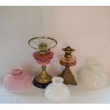 Two late 19th/early 20th century paraffin lamps with 3 shades plus a hanging paraffin lamp