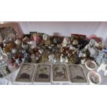 A large collection of elephants to include mirror, clocks, plaques and ornaments etc