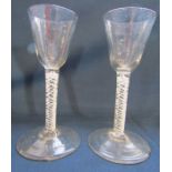 A pair of 18th century air twist glasses approx. Ht. 14.5cm (chips to base)