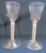 A pair of 18th century air twist glasses approx. Ht. 14.5cm (chips to base)