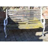 Garden bench with ornate cast metal ends