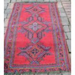 Turkey red wool carpet 169cm (inc tassels) x 90cm
