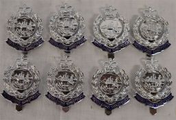 Eight unused Royal Hong Kong Police cap badges - all marked to the rear FIRMIN LONDON