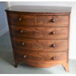 Georgian bow fronted chest of drawers on splayed bracket feet with wooden knobs