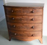 Georgian bow fronted chest of drawers on splayed bracket feet with wooden knobs