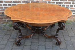 Ornate Victorian salon table with burr walnut veneer top inlaid with boxwood on heavily carved