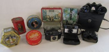 A collection of vintage tins, Kodak instamatic, Kodak Brownie and Tarka and Ultraview binoculars