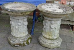 Pair of bird baths on columns with classical friezes