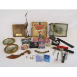Collection of items to include playing cards, corkscrews, brass herons, Pathescope film,