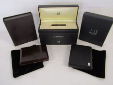 Alfred Dunhill White Spot Sidecar cigarette case, a Dunhill cigarette case PA 9106 and a Dunhill