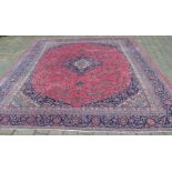 Very large pink ground Persian Kashmir carpet with traditional floral medallion 375cm by 285cm