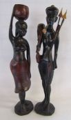 A pair of heavy wooden African tribal figures approx. 75cm tall