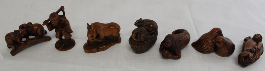 7 Japanese hardwood netsuke:- 2 rats on a bridge, lady holding a squid, old man, mermaid holding a