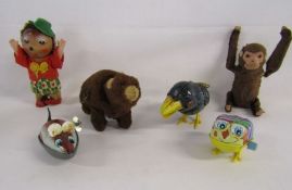 Collection of wind up toys to include a walking bear, Kohler bird (no key), monkey (no key),