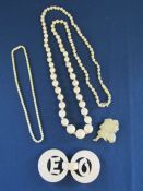 Collection of ivory items to include 2 bead necklaces and possibly bone brooch