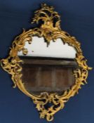 Ormolu framed wall mirror (with candle apertures either side) measures approximately 40cm wide /