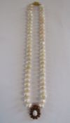 Natural pearl necklace with tested as 18ct gold and ruby pendant - in a Liberty of London case
