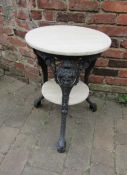 Cast metal bistro table with heavy top and middle