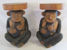 Pair of heavy wooden monkey side tables