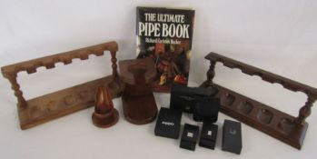 Collection of pipe stands, The Ultimate Pipe Book, and some empty Dunhill and Zippo boxes some