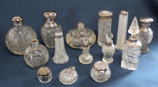 Selection of cut glass dressing table pots / bottles - mostly with silver collars / lids