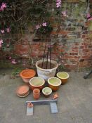 Collection of garden pots to include a large planter, metal trellis terracotta pots and plates etc
