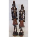 Pair of African tribal figures with beads and shells tall one approx.28.5cm - other approx. 27.5cm