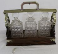 Late Victorian rosewood (repaired) 3 decanter tantalus (one damaged)