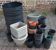 5 large plastic tubs and various plastic garden planters & pots