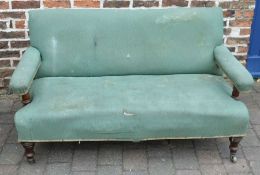 Victorian open arm sofa by Howard & Sons of London.  Damage & repairs to back legs. L144cm D 81cm Ht