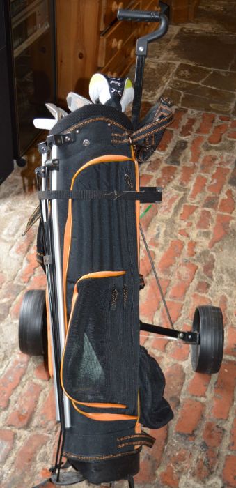 Junior left handed set of golf clubs in a caddy